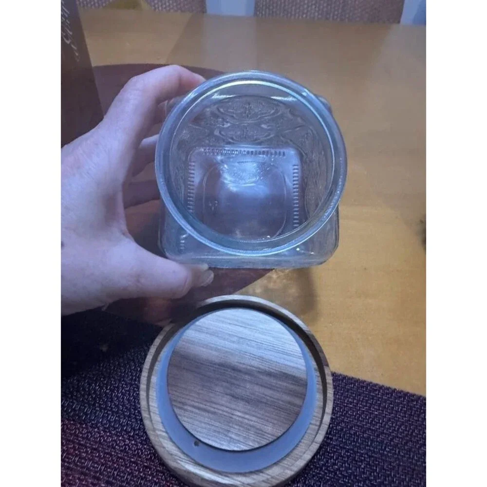 Embossed glass storage jar